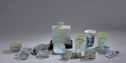 null LOT including a glazed ceramic vase, porcelain cups, three white-blue porcelain...