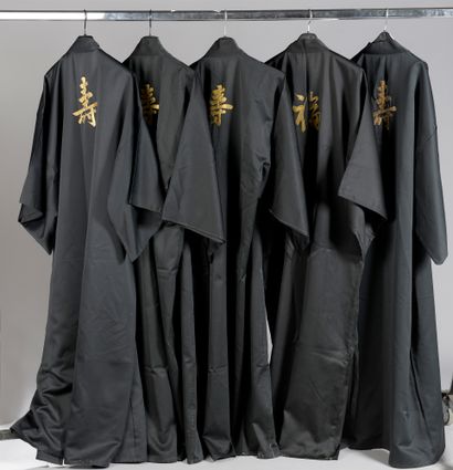 null SET OF FIVE black KIMONOS embroidered with golden ideograms on the back.