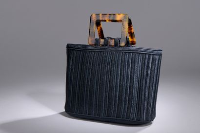 null Yves SAINT-LAURENT Rive Gauche

Blue silk cord handbag with tortoiseshell handles.

27...