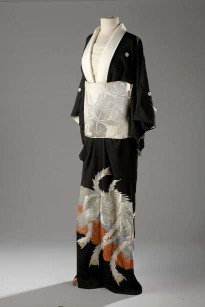 null KIMONO in black crepe with gold and silver lamé decoration of a phoenix. Belt...