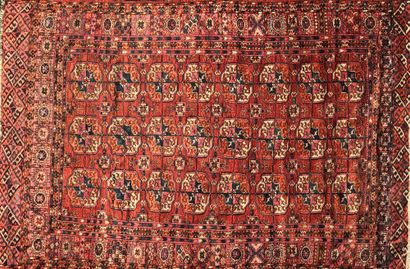 null Bukhara RUG with classical decoration of elephants' feet on a burgundy background....