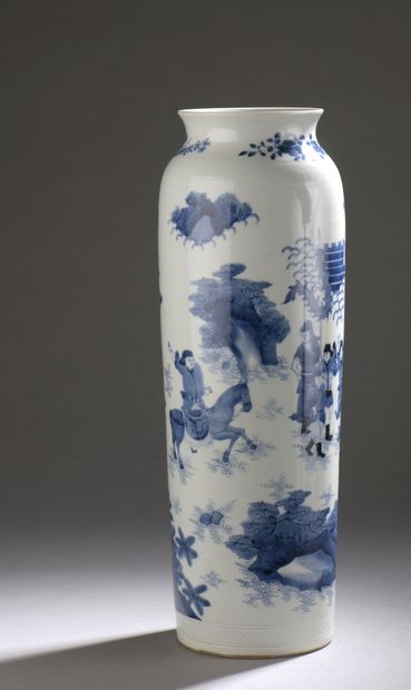 null A white porcelain scroll vase decorated in blue underglaze with a genre scene....