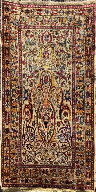 null LITTLE Persian Hereke silk carpet decorated with foliage and flowers on a cream...