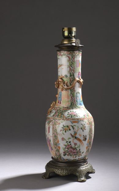null Bottle-shaped porcelain vase decorated with polychrome enamels of medallions...