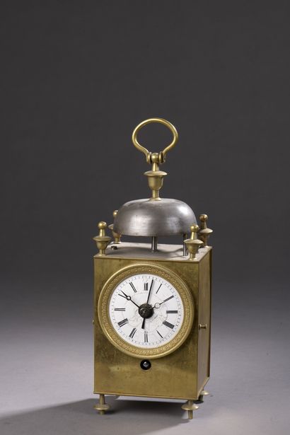null CAGE CLOCK called Capucine in gilded brass. Spiral balance. Repeater and alarm...