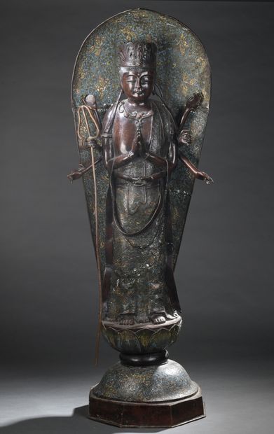 null A bronze and cloisonné enamel STATUTE of the ten-armed goddess Kannon, standing...