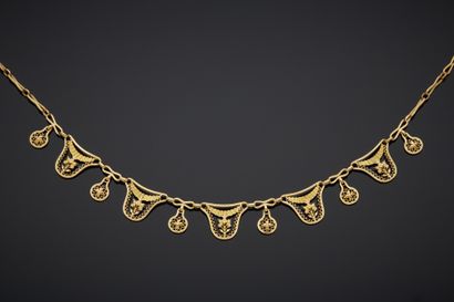 null Necklace in 18K yellow gold 750‰, openwork drapery of bouquets and scandé of...