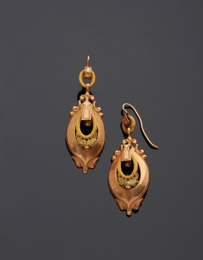 null A pair of 18K polychrome gold 750‰ earrings, adorned with ovoid, pierced and...