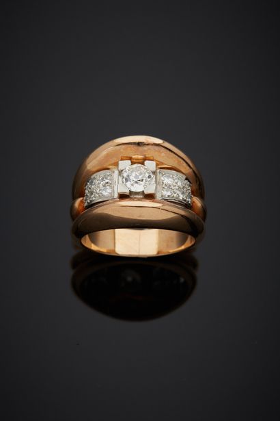 null An 18K yellow gold 750‰ and platinum 850‰ band ring, set with an old-cut diamond...