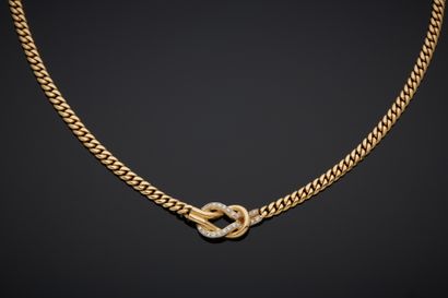null Two-tone 18K gold necklace 750‰, adorned with a figure-of-eight knot design,...