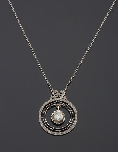 null Platinum 850‰ necklace, adorned with a round design topped with a bow, in the...
