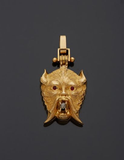 null An 18K yellow gold 750‰ pendant, in the form of a mascaron, the eyes set with...