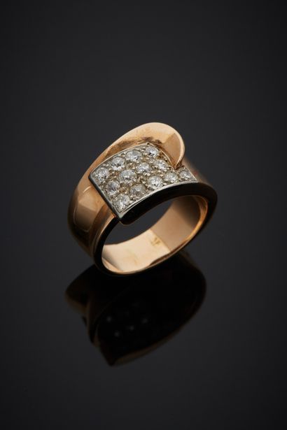 null An 18K yellow gold 750‰ and platinum 850‰ asymmetrical ring, adorned with a...