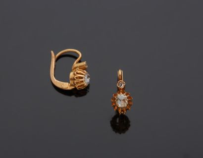 null A pair of 18K yellow gold 750‰ sleeper earrings, set with two rose-cut diamonds....