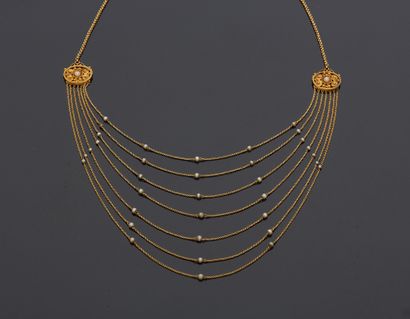 null Necklace in 18K yellow gold 750‰, composed of seven rows of jaseron mesh, scandés...