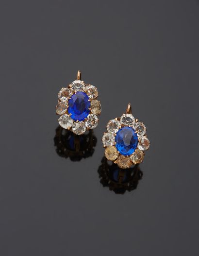 null Pair of 18K yellow gold 750‰ sleeper earrings, set with white and blue stones.

Gross...