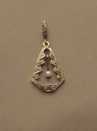 An 18K 750‰ two-tone gold pendant, adorned...