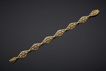 Curb in 18K yellow gold 750‰ with oval motifs...