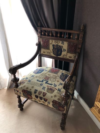 null Natural wood armchair in the Renaissance style, fabric upholstery decorated...