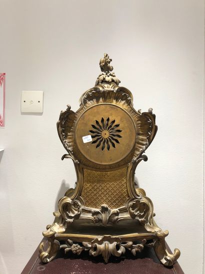 null Raingo Frères clock in Paris in gilt bronze and chased with rocaille decoration,...