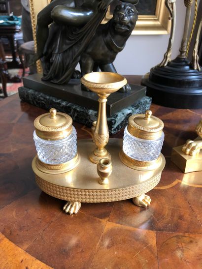 null A small oval shaped inkwell in cut glass, gilt bronze and chased bronze, standing...