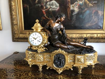 Large patinated and gilt bronze clock, representing...