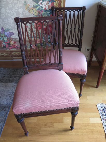 A pair of mahogany chairs with openwork backs....