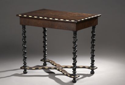 null Small table, top inlaid with exotic woods and bone.


Four turned wood legs,...
