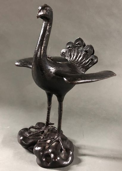Bronze incense burner with a peacock on a...