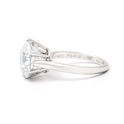 null 
Chaumet.





Solitaire ring in 18K white gold centered with a large round...