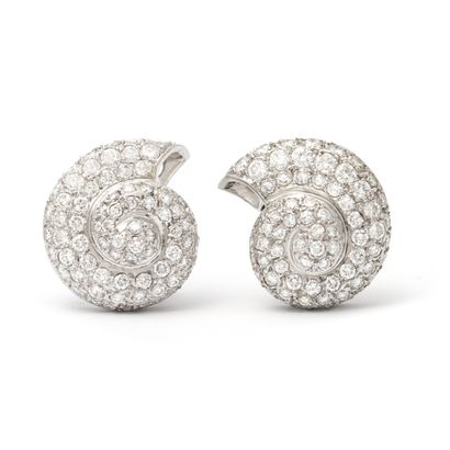 null Pair of ear clips in 18K white gold paved with round diamonds.

Weight diamonds:...