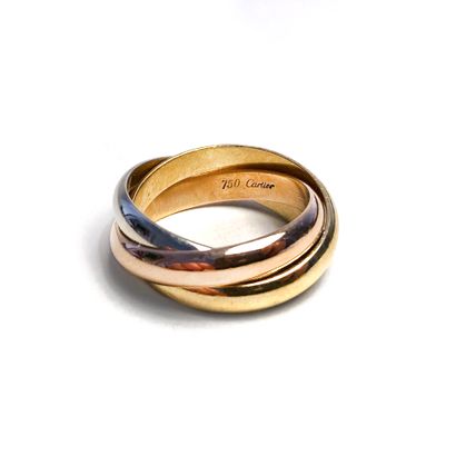 null Cartier.

Three gold rings 18K 750/1000.

Trinity model. Signed Cartier.

Finger...