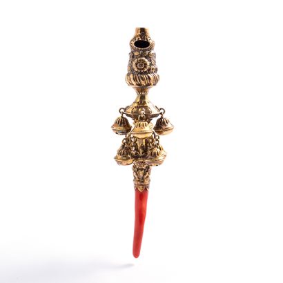 null Rattle with bells and whistle in gilt, handle in coral**.

English work. 18th...