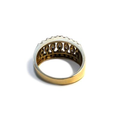  An 18k yellow gold ring set with round and marquise-cut diamonds. 
Finger size:...