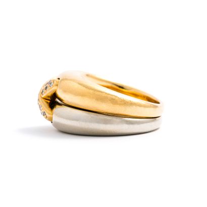 null Chaumet.

Yellow and white gold ring centered with a link motif set with round...