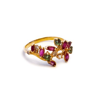null An 18K yellow gold floral ring set with diamonds, emeralds and rubies.

Finger...