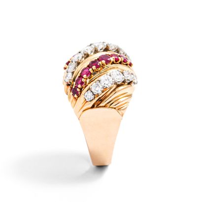 null 18K yellow gold ring set with round diamonds and rubies.

Weight of the diamonds:...