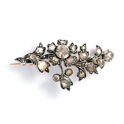  Gold and silver floral brooch set with rose-cut diamonds. 
Late 19th century. 
Height:...