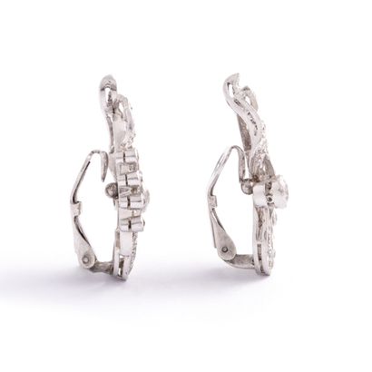 null Pair of platinum and white gold ear clips set with old cut diamonds.

Height:...