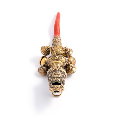 null Rattle with bells and whistle in gilt, handle in coral**.

English work. 18th...