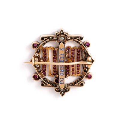 null Gold and silver brooch set with old cut diamonds and rubies.

Inscription in...