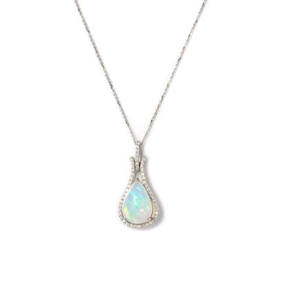 null Pendant in white gold 18K 750/1000th centered of an opal surrounded by round...