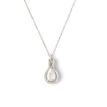 null Pendant in 18K white gold 750/1000th centered with a pear cut diamond weighing...