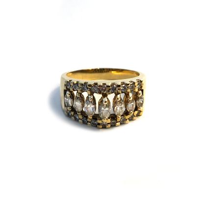  An 18k yellow gold ring set with round and marquise-cut diamonds. 
Finger size:...