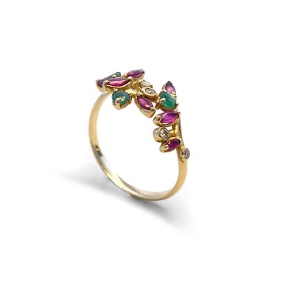 null An 18K yellow gold floral ring set with diamonds, emeralds and rubies.

Finger...