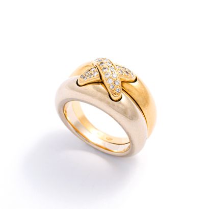 null Chaumet.

Yellow and white gold ring centered with a link motif set with round...