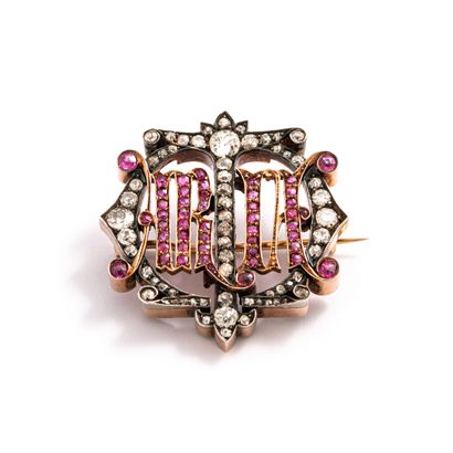 null Gold and silver brooch set with old cut diamonds and rubies.

Inscription in...