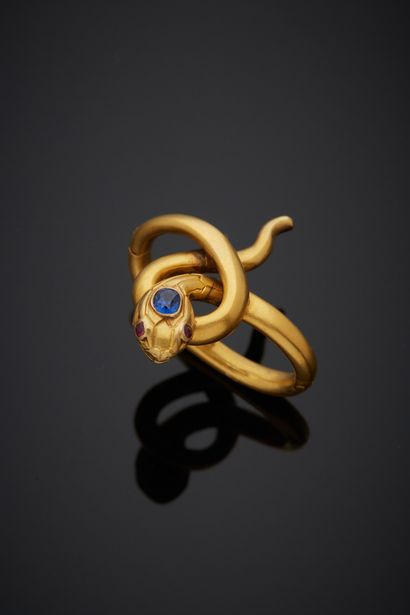null 18K yellow gold 750‰ necklace, in the form of a snake, the head set with a sapphire,...
