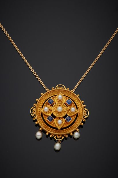 null An 18K yellow gold 750‰ necklace, adorned with a round-shaped element set with...