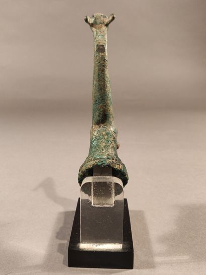 null Two bronze sharpening handles, one of which represents a protome of ibex and...